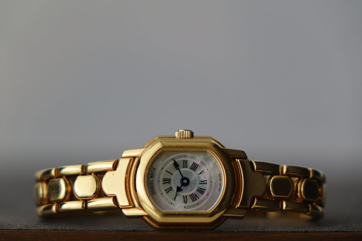 Daniel roth ladies mop dial gold bracelet watch only